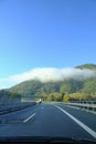 scenic highway in the mountains. car driving on a highway. Transportation, travel concept Royalty Free Stock Photo