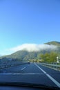 scenic highway in the mountains. car driving on a highway. Transportation, travel conce Royalty Free Stock Photo