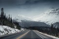 Scenic highway road trip with snow mountain in gloomy at Icefields Parkway Royalty Free Stock Photo