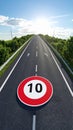 Scenic highway with speed limit 10 sign and sunlit sky Royalty Free Stock Photo