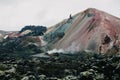 scenic icelandic landscape with magnificent rock formations and steam from hot springs,