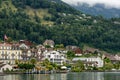 Scenic image of modern buildings situated near the tranquil waters of Switzerland