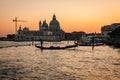 Scenic image of picturesque chanels of Venice siluettes at sunset, Italy