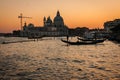 Scenic image of picturesque chanels of Venice siluettes at sunset, Italy