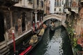 Scenic italian canal with gondola, Venice, Italy Royalty Free Stock Photo