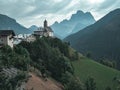 Scenic Italian Dolomites with a picturesque mountain range with a charming church