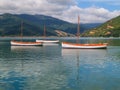 Scenic Kenepuru Sound images clinker sailing boats with masts moored together