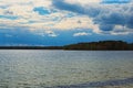 Scenic lake landscape in the forest. Rays of the sun are reflected in the blue water. Pisochne ozero Royalty Free Stock Photo