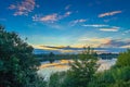 Scenic lake landscape. Sundown colorful sky