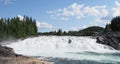 Scenic Laksforsen waterfall at Vefsna river in Grane town in Norway Royalty Free Stock Photo