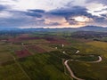 Scenic landscape aerial view of field river and basin against a natural mountain, Drone shot tropical landscape with noise and Royalty Free Stock Photo