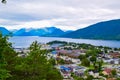 Scenic landscape Andalsnes city located on shores of Romsdal Fjord between the picturesque mountains. View from Rampestreken Royalty Free Stock Photo