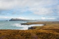 Scenic landscape with atlantic ocean shore, many mountains tops, hills and picturesque irish village during winter autumn season Royalty Free Stock Photo