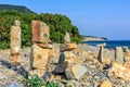 Scenic landscape of Black Sea coast by Bolshoy Utrish village, Anapa, Russia. Stone towers on pebble beach on blue sky sunny