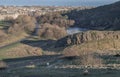 Scenic landscape of Holyrood Park on Salisbury Crags with cityscape of Edinburgh city Royalty Free Stock Photo