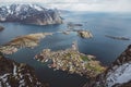 Scenic landscape of Lofoten islands: peaks, lakes, and houses. Reine village, rorbu, reinbringen