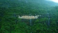 an area with lush green trees and water on it, with a small waterfall in Royalty Free Stock Photo