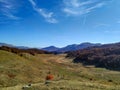 Scenic landscape in the mountain region while walking, hiking, trekking and climbing on a beautiful autumn fall day Royalty Free Stock Photo