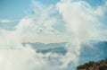 Scenic landscape of mountains in clouds and rocky steep coast of the Aegean Sea Royalty Free Stock Photo