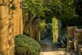 Scenic landscape of old narrow street in one of the most beautiful villages of France Lacoste, Luberon, Vaucluse, Provence with Royalty Free Stock Photo