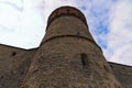 Scenic landscape photo of ancient Kamianets-Podilskyi Castle. High and thick stone walls with tower against blue sky Royalty Free Stock Photo