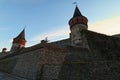 Scenic landscape photo of ancient Kamianets-Podilskyi Castle. High and thick stone walls with towers against blue sky. Royalty Free Stock Photo