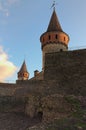 Scenic landscape photo of ancient Kamianets-Podilskyi Castle. High and thick stone walls with towers against blue sky Royalty Free Stock Photo