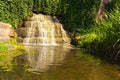 Scenic landscape photo of small waterfall near place called Ancient Ruins in the Arboretum Alexandria in Bila Tserkva, Ukraine.