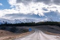 A scenic landscape of road to Aoraki Mount Cook - Lake Pukaki with blue sky and clouds. Royalty Free Stock Photo