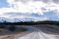 A scenic landscape of road to Aoraki Mount Cook - Lake Pukaki with blue sky and clouds. Royalty Free Stock Photo
