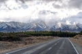 A scenic landscape of road to Aoraki Mount Cook - Lake Pukaki with blue sky and clouds. Royalty Free Stock Photo