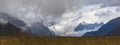 Scenic landscape of rocky mountains covered in a blanket of fluffy clouds. New Zealand Royalty Free Stock Photo