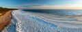 Scenic landscape of shore of Baltic sea at winter. Snow on sand. Royalty Free Stock Photo
