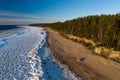 Scenic landscape of shore of Baltic sea at winter. Snow on sand. Royalty Free Stock Photo