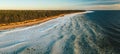 Scenic landscape of shore of Baltic sea at winter. Snow on sand. Royalty Free Stock Photo
