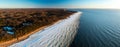 Scenic landscape of shore of Baltic sea at winter. Snow on sand. Royalty Free Stock Photo