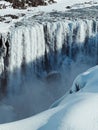 Scenic landscape shot of a majestic frozen waterfall in winter Royalty Free Stock Photo