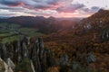 Scenic landscape in Sulov, Slovakia, on beautiful autumn sunrise with colorful leaves on trees in forest and bizarre pointy rocks Royalty Free Stock Photo