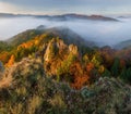 Scenic landscape in Sulov, Slovakia, on beautiful autumn sunrise with colorful leaves on trees in forest and bizarre pointy rocks Royalty Free Stock Photo