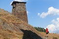 Scenic landscape of summer morning in the Caucasus mountains. Sun just came out and illuminates ancient ruins of Tushetian towers Royalty Free Stock Photo