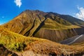 Scenic landscape of summer morning in the Caucasus mountains. Sun just came out and illuminates landscape. Trekking from Omalo. Royalty Free Stock Photo