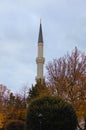 Scenic landscape view of ancient minaret against cloudy sky. Minaret of the mosque of Hagia Sophia in Sultan Ahmed Park Royalty Free Stock Photo