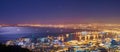 Scenic landscape view of Cape Town city and harbour lit at night after sunset from Signal Hill, South Africa Royalty Free Stock Photo