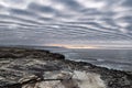 Scenic landscape view of coastline against dramatic cloudy sky Royalty Free Stock Photo