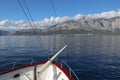 Scenic landscape view of the Croatian sea coast, mountains, sky and clouds from a pleasure boat Royalty Free Stock Photo