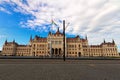 Scenic landscape view of The Hungarian Parliament Building. Square in front of the building with many tourists Royalty Free Stock Photo
