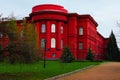 Scenic landscape view of main red building of National Taras Shevchenko University in Kyiv. Cloudy spring day