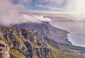 Scenic landscape view of Table Mountain in Cape Town, Western Cape during summer. Beautiful scenery of clouds rolling Royalty Free Stock Photo