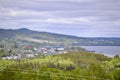 Scenic landscape view of town, water, and hills along Newfoundland highway Royalty Free Stock Photo