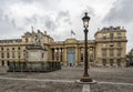 A scenic lightpost and a sculpture on a square in front of National Assembly building, Paris Royalty Free Stock Photo